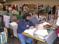 077 - Ed Kramer signing in Dealers Room